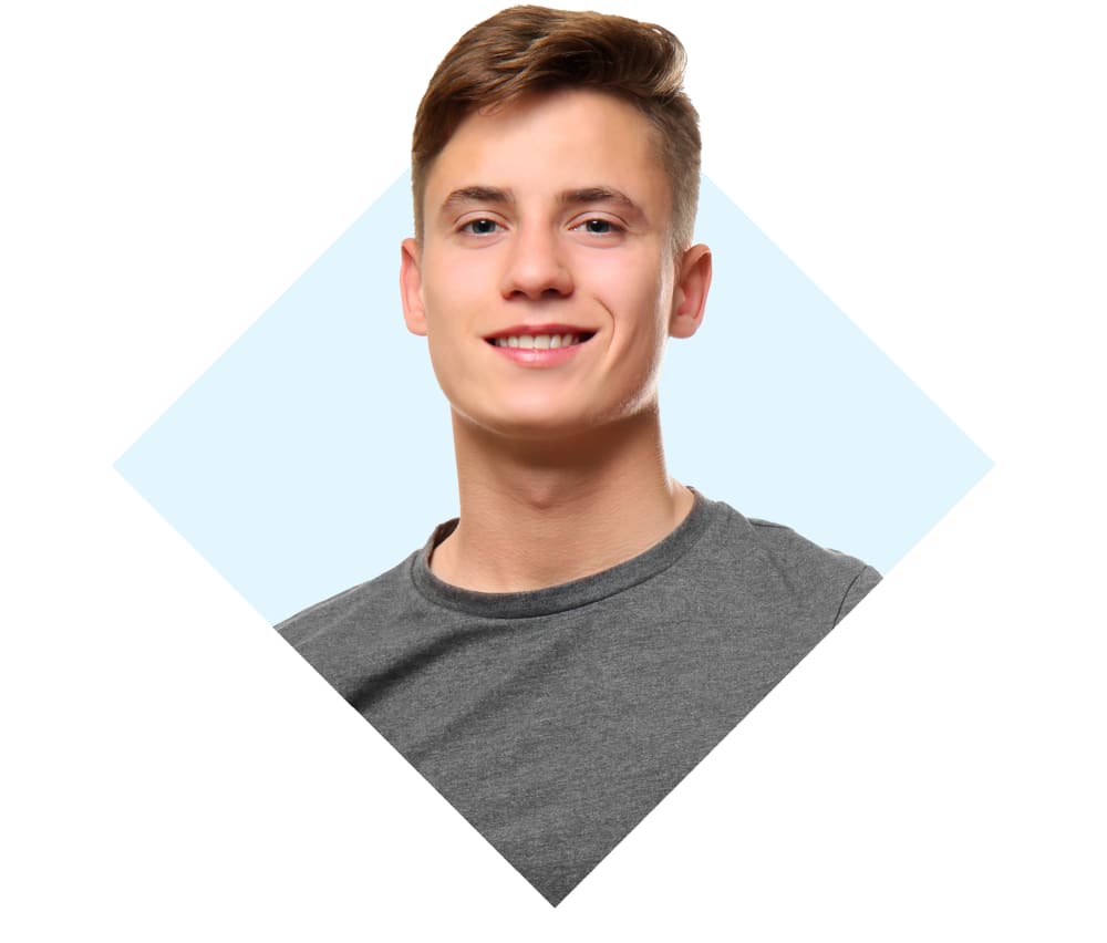 Well groomed teenage boy smiling for the camera.